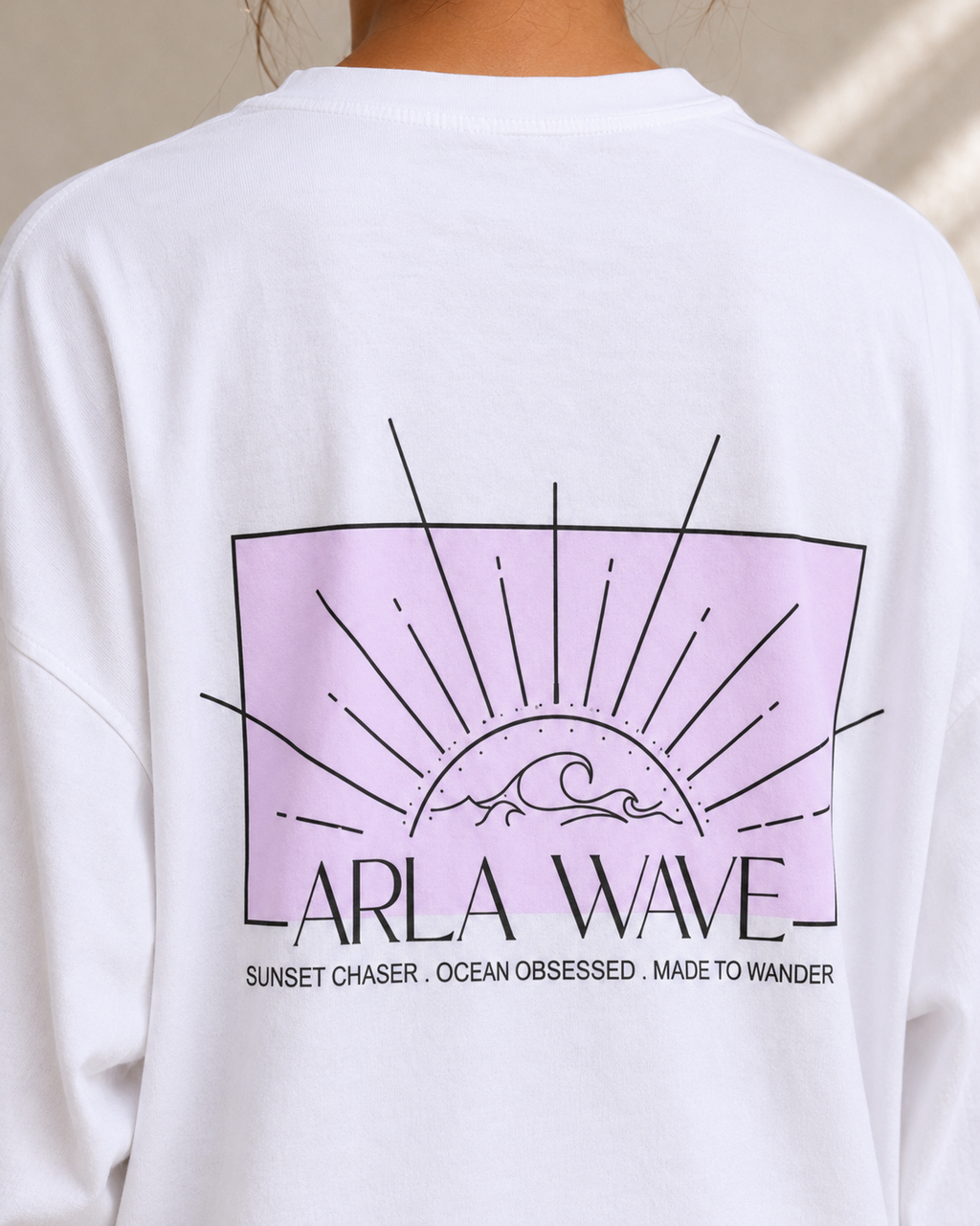 White oversized cropped long sleeve shirt with pink detailing and Arla Wave logo, back view