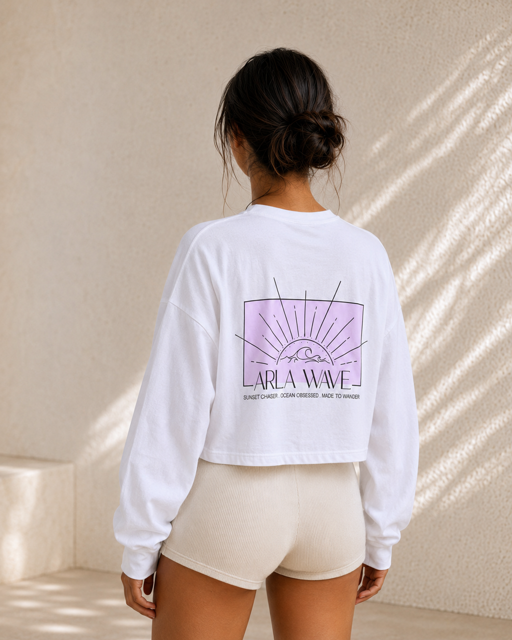 White oversized cropped long sleeve shirt with pink detailing, back view