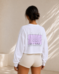 White oversized cropped long sleeve shirt with pink detailing, back view
